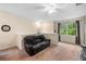 Upstairs living room area features a large window with plenty of natural light at 3613 Parkridge Cir # 11-201, Sarasota, FL 34243