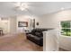 Living room with ample seating, natural light, and ceiling fan at 3613 Parkridge Cir # 11-201, Sarasota, FL 34243