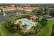 Aerial view of an in-ground pool featuring a gazebo, lounge furniture, landscaping, and a fountain at 3613 Parkridge Cir # 11-201, Sarasota, FL 34243