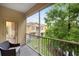 Screened patio overlooking manicured landscaping and views of adjacent building at 3613 Parkridge Cir # 11-201, Sarasota, FL 34243