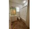 Well lit bathroom including bath tub, shower and single sink vanity at 3790 Cadbury Cir # 40, Venice, FL 34293