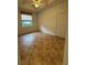 Bedroom with neutral walls, tile flooring, and a ceiling fan, offering a comfortable living space at 3790 Cadbury Cir # 40, Venice, FL 34293