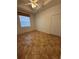 Bedroom featuring neutral walls, tile flooring, and a ceiling fan, providing a serene environment at 3790 Cadbury Cir # 40, Venice, FL 34293