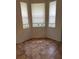 Cozy breakfast nook with large windows, tile floors, and ample natural light, perfect for enjoying morning coffee at 3790 Cadbury Cir # 40, Venice, FL 34293