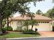 Charming one-story home with a well-maintained lawn and lush landscaping at 3790 Cadbury Cir # 40, Venice, FL 34293