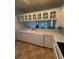 Bright kitchen with white cabinets, modern appliances, tile floors and a mirrored backsplash, perfect for the home chef at 3790 Cadbury Cir # 40, Venice, FL 34293