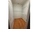 Functional walk-in closet with wood flooring and wire shelving for optimal storage at 3790 Cadbury Cir # 40, Venice, FL 34293