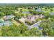 Scenic aerial view of the community clubhouse, pool, tennis courts, golf course, and beautiful landscaping at 4740 Royal Dornoch Cir, Bradenton, FL 34211