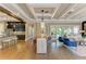 Open dining area showcases coffered ceilings, a wooden table, and seamless flow to the kitchen and living spaces at 4740 Royal Dornoch Cir, Bradenton, FL 34211