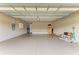 Spacious three car garage featuring sealed floors and ample storage space at 4740 Royal Dornoch Cir, Bradenton, FL 34211