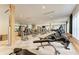 A spacious gym features modern exercise equipment and mirrored walls for a complete fitness experience at 4740 Royal Dornoch Cir, Bradenton, FL 34211