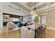 Open-concept living space with coffered ceilings, built-in cabinetry, and a seamless flow to the outdoor areas at 4740 Royal Dornoch Cir, Bradenton, FL 34211