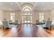 Inviting lobby with wood floors, striped chairs, and bright windows creates a welcoming atmosphere at 4740 Royal Dornoch Cir, Bradenton, FL 34211