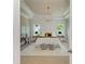 Beautifully decorated primary suite with tray ceilings, a chandelier and paneled walls at 4740 Royal Dornoch Cir, Bradenton, FL 34211