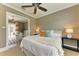 Relaxing bedroom with a ceiling fan, access to a study, and natural light, enhancing the room's appeal at 4740 Royal Dornoch Cir, Bradenton, FL 34211