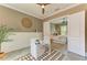 Charming office with a view into the bedroom, white desk, and a decorative rug on the floor at 4740 Royal Dornoch Cir, Bradenton, FL 34211