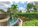 Beautiful patio featuring a tranquil pool and surrounding tropical plants, perfect for relaxing outdoors at 4740 Royal Dornoch Cir, Bradenton, FL 34211