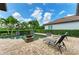 Relaxing poolside retreat featuring lounge chairs and elegant water features, creating a luxurious outdoor living space at 4740 Royal Dornoch Cir, Bradenton, FL 34211