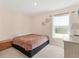 Simple bedroom with a neutral walls, a ceiling fan, carpeted floor, and a window at 4890 Laramie Cir, North Port, FL 34286
