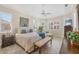 Spacious bedroom with plantation shutters and tray ceilings, filled with natural light at 5018 Bella Terra Dr, Venice, FL 34293