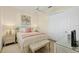 Charming bedroom with a comfortable bed, stylish decor, and ample closet space at 5018 Bella Terra Dr, Venice, FL 34293