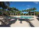 Expansive community pool and spa area with ample seating, perfect for relaxation at 5018 Bella Terra Dr, Venice, FL 34293