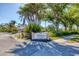 Elegant entrance sign for The Venetia Club residents, surrounded by lush landscaping at 5018 Bella Terra Dr, Venice, FL 34293