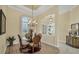 A cozy dining nook shows a glass table, archway view, and decorative lighting fixture at 5018 Bella Terra Dr, Venice, FL 34293
