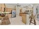 Spacious kitchen with stainless steel appliances, marble floors, and granite countertops at 5018 Bella Terra Dr, Venice, FL 34293