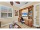 Well-lit office space featuring custom wood built-ins and a large window at 5018 Bella Terra Dr, Venice, FL 34293