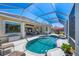 Gorgeous pool with covered lanai, spa, and inviting seating area at 5018 Bella Terra Dr, Venice, FL 34293