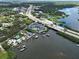 A high aerial of condo building complex, waterfront, docks, easy access to highway with nearby homes at 516 Tamiami S Trl # 303, Nokomis, FL 34275