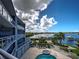 Building featuring pool, hot tub, and gorgeous waterfront views at 516 Tamiami S Trl # 303, Nokomis, FL 34275