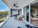 Comfortable balcony with seating and views of trees and a river at 516 Tamiami S Trl # 303, Nokomis, FL 34275