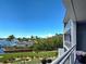 Balcony with a scenic view of lush landscaping and waterfront at 516 Tamiami S Trl # 303, Nokomis, FL 34275