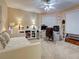 Spacious bedroom with a ceiling fan, daybed, and built-in shelves and cabinets at 516 Tamiami S Trl # 303, Nokomis, FL 34275