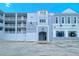 Exterior shot of the Harbor Villas at Dona Bay, showing the building's entrance at 516 Tamiami S Trl # 303, Nokomis, FL 34275
