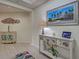 Tastefully decorated condo foyer featuring coastal decor, and neutral paint at 516 Tamiami S Trl # 303, Nokomis, FL 34275
