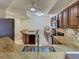 Open concept kitchen with stainless steel appliances, granite countertops and center island at 516 Tamiami S Trl # 303, Nokomis, FL 34275