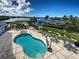 Exterior shot of the swimming pool and spa with patio seating and a waterfront view at 516 Tamiami S Trl # 303, Nokomis, FL 34275