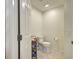 Efficient powder room features tile floors and modern fixtures at 516 Tamiami S Trl # 303, Nokomis, FL 34275
