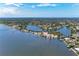 Expansive aerial view of a waterfront community featuring picturesque waterways, lush greenery, and beautiful residential homes at 5207 5Th Avenue Nw Dr, Bradenton, FL 34209