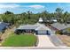 Sprawling property showcasing a well-maintained lawn, charming exterior, and a serene neighborhood setting at 5207 5Th Avenue Nw Dr, Bradenton, FL 34209