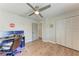 Bedroom featuring a workstation, hardwood floors, and closet at 5207 5Th Avenue Nw Dr, Bradenton, FL 34209