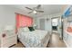 Comfortable bedroom with wood floors, a ceiling fan, and access to the bathroom at 5207 5Th Avenue Nw Dr, Bradenton, FL 34209