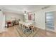 Bright dining room featuring wood floors, updated door, and classic furnishings at 5207 5Th Avenue Nw Dr, Bradenton, FL 34209