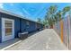 Exterior of home and shed with fenced in area on a gravel drive at 5207 5Th Avenue Nw Dr, Bradenton, FL 34209