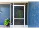 Inviting front entrance features a screened porch and decorative plants for a warm welcome at 5207 5Th Avenue Nw Dr, Bradenton, FL 34209
