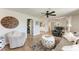 Spacious living area with hardwood floors, comfortable seating, and open access to other rooms, ideal for entertaining at 5207 5Th Avenue Nw Dr, Bradenton, FL 34209