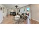 Bright living room featuring hardwood floors, large windows, and stylish furniture, creating a welcoming atmosphere at 5207 5Th Avenue Nw Dr, Bradenton, FL 34209